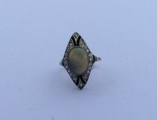 A stylish opal, onyx and diamond cluster ring in t