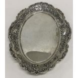 A Continental silver oval letter tray decorated wi