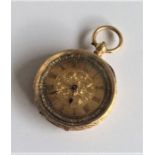 A lady's 18 carat fob watch attractively decorated