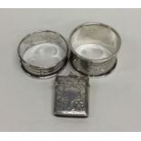 A heavy silver engraved vesta case together with t