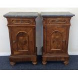 A pair of Continental marble top bedside cabinets