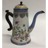 An unusual enamelled tapering coffee pot decorated