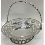 A large oval Georgian silver pierced basket with s