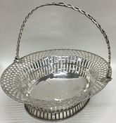 A large oval Georgian silver pierced basket with s