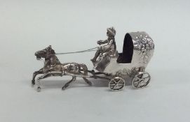 A large silver model of a horse and cart. Approx.