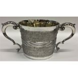 An unusual George III silver two handled porringer