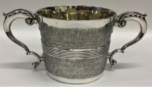 An unusual George III silver two handled porringer