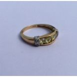 A citrine and diamond half hoop ring in gold. Appr