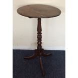 An early Victorian circular occasional table on sp