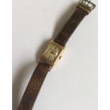 A gent's 9 carat wristwatch on leather strap. Appr