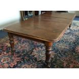 A large Victorian mahogany extending table with th