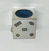 A stylish cube shaped silver snooker chalk holder