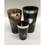 A rare set of three tapering horn beakers with sil