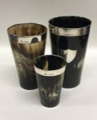 A rare set of three tapering horn beakers with sil