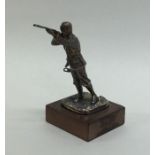 A good quality cast silver figure of a man shootin