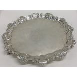 A Good George II silver salver with shell border a