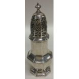 A rare George I silver caster with pierced lift-of