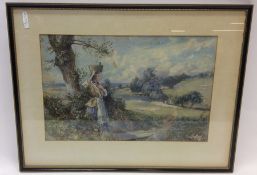 A framed and glazed watercolour depicting a landsc