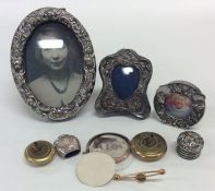 A bag containing silver picture frames, buttons et