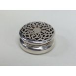 An Edwardian silver pierced jar and cover with gil