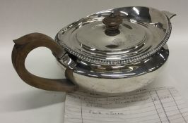 A rare silver Georgian teapot with gadroon rim and