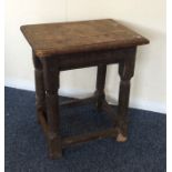 A Georgian oak joint stool with stretcher base. Es