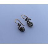 A pair of pearl and diamond hoop earrings with loo