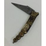 An unusual Antique ivory mounted penknife with bra
