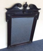 A Continental mahogany bevel edged mirror with scr