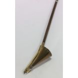 An unusual brass mounted church candle snuffer