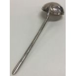 A Turkish silver spoon with fluted handle. Punched