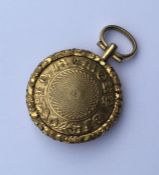 An Antique gilt locket with loop top and fitted in