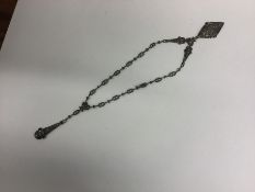 A stylish silver and marcasite necklace with match