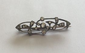 A Victorian diamond mounted brooch in the form of