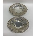 A pair of oval silver embossed bonbon dishes decor