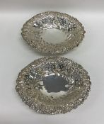 A pair of oval silver embossed bonbon dishes decor