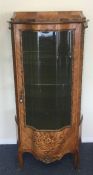 A good kingswood vitrine with shaped glass front i