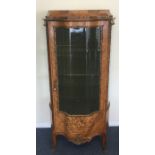 A good kingswood vitrine with shaped glass front i