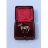 A good quality gold brooch in the form of a donkey