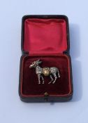 A good quality gold brooch in the form of a donkey