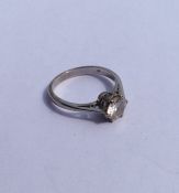 A diamond single stone mounted as a ring in claw m