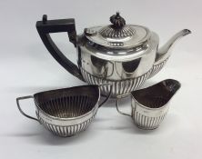 An Edwardian silver three piece tea service. Birmi