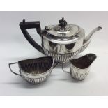 An Edwardian silver three piece tea service. Birmi