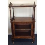 A Victorian walnut music cabinet with pierced deco