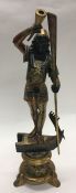 A large gilt figure in the form of a Blackamoor on