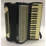 A cased accordion by Frisco. Est. £30 - £50.