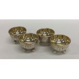 An unusual set of four silver gilt salts in the fo