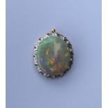 A good opal and diamond large pendant with brillia
