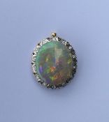 A good opal and diamond large pendant with brillia