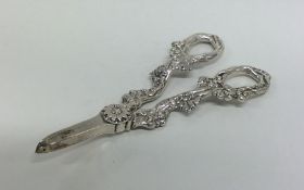 A heavy pair of silver cast grape scissors. London